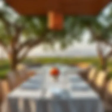 A beautifully set dining table with an elegant backdrop of Al Barari's landscape